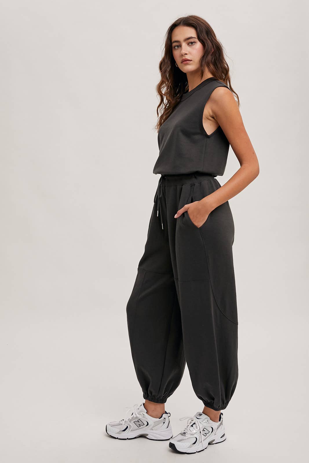 DRAWSTRING WAIST SLEEVELESS KNIT ACIVE JUMPSUIT: ECRU