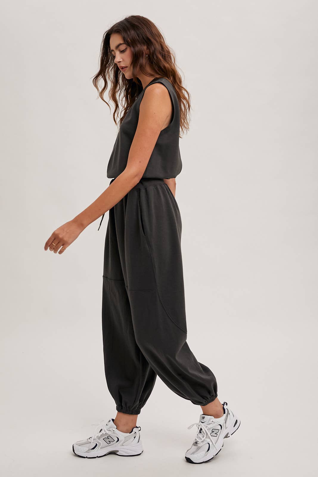 DRAWSTRING WAIST SLEEVELESS KNIT ACIVE JUMPSUIT: ECRU