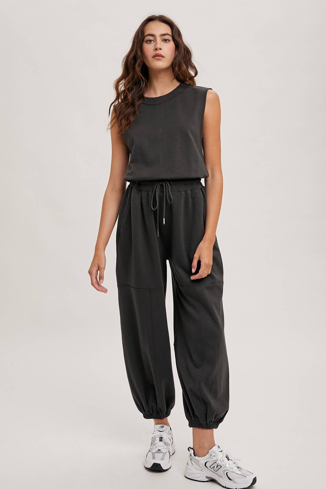 DRAWSTRING WAIST SLEEVELESS KNIT ACIVE JUMPSUIT: ECRU