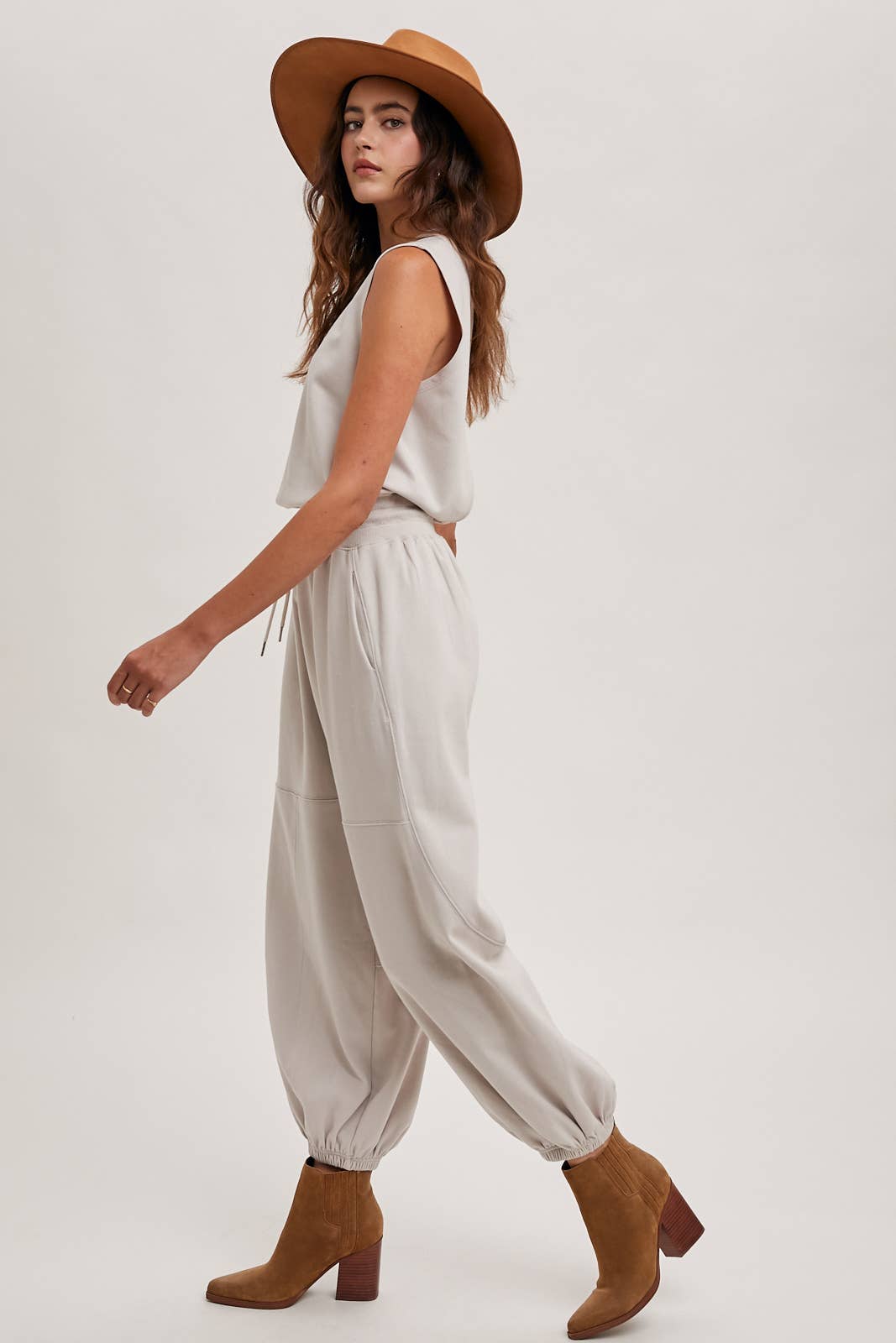 DRAWSTRING WAIST SLEEVELESS KNIT ACIVE JUMPSUIT: ECRU