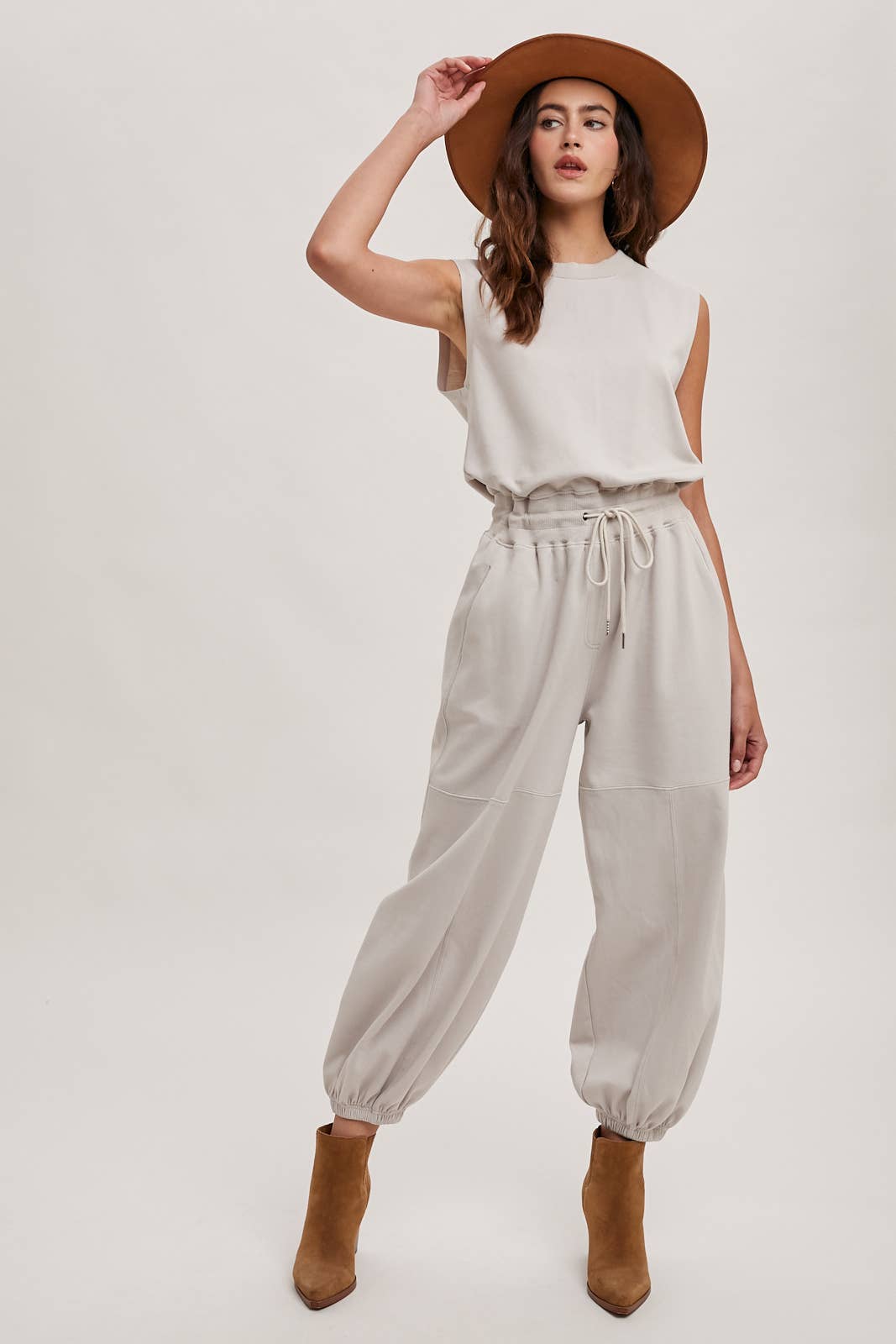 DRAWSTRING WAIST SLEEVELESS KNIT ACIVE JUMPSUIT: ECRU