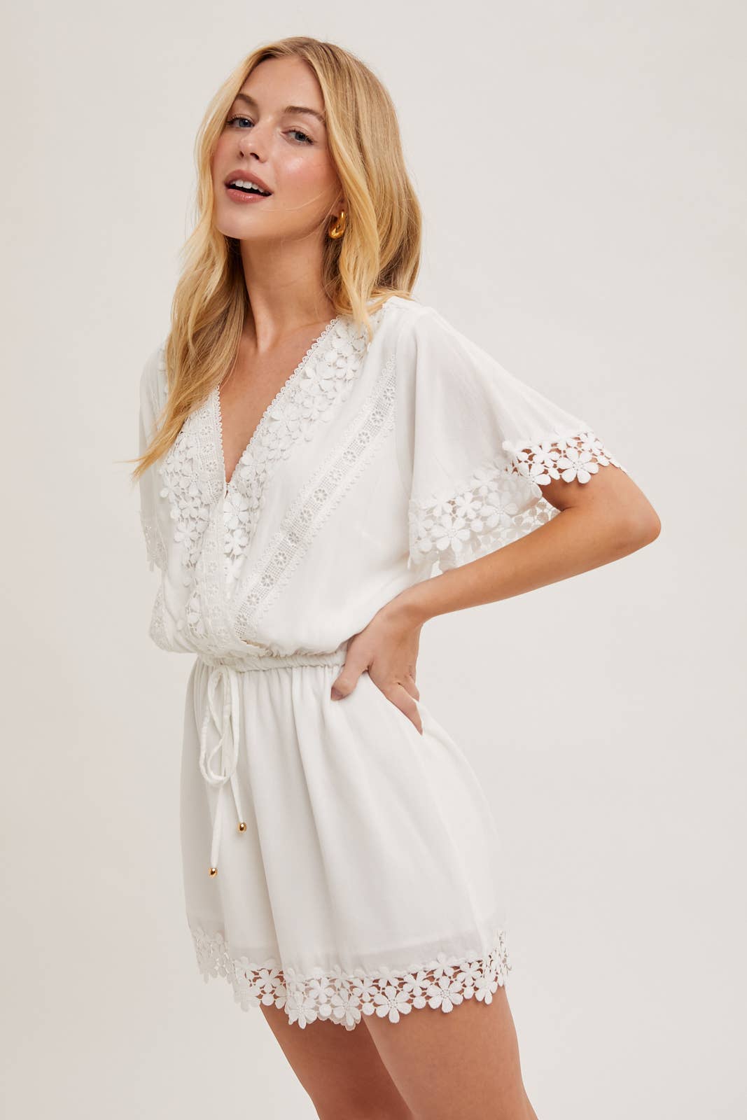 WRAP FLORAL LACE TRIMMED DRAWSTRING ROMPER: ALMOND