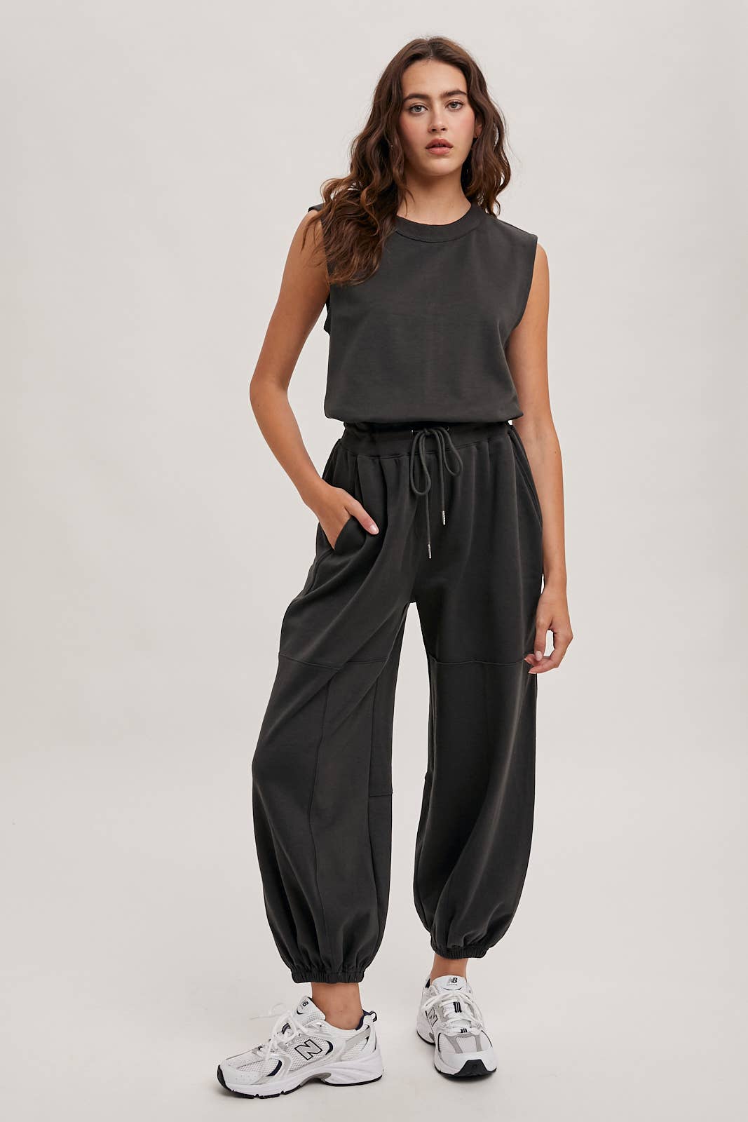 DRAWSTRING WAIST SLEEVELESS KNIT ACIVE JUMPSUIT: ECRU