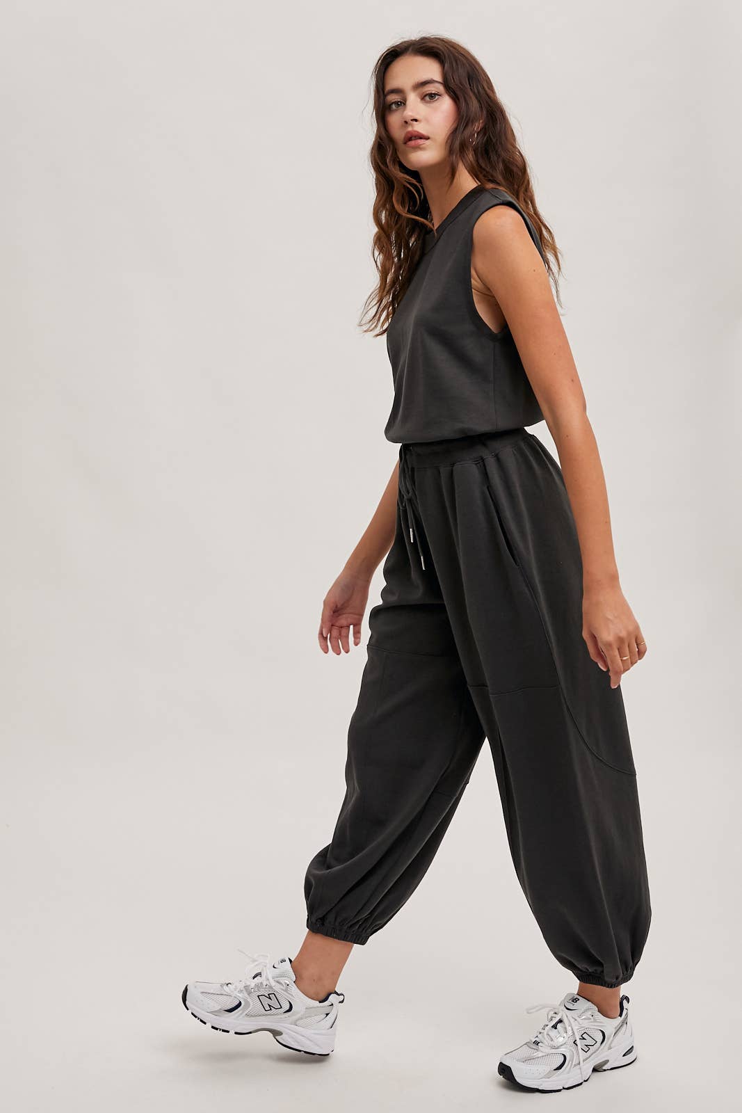 DRAWSTRING WAIST SLEEVELESS KNIT ACIVE JUMPSUIT: ECRU