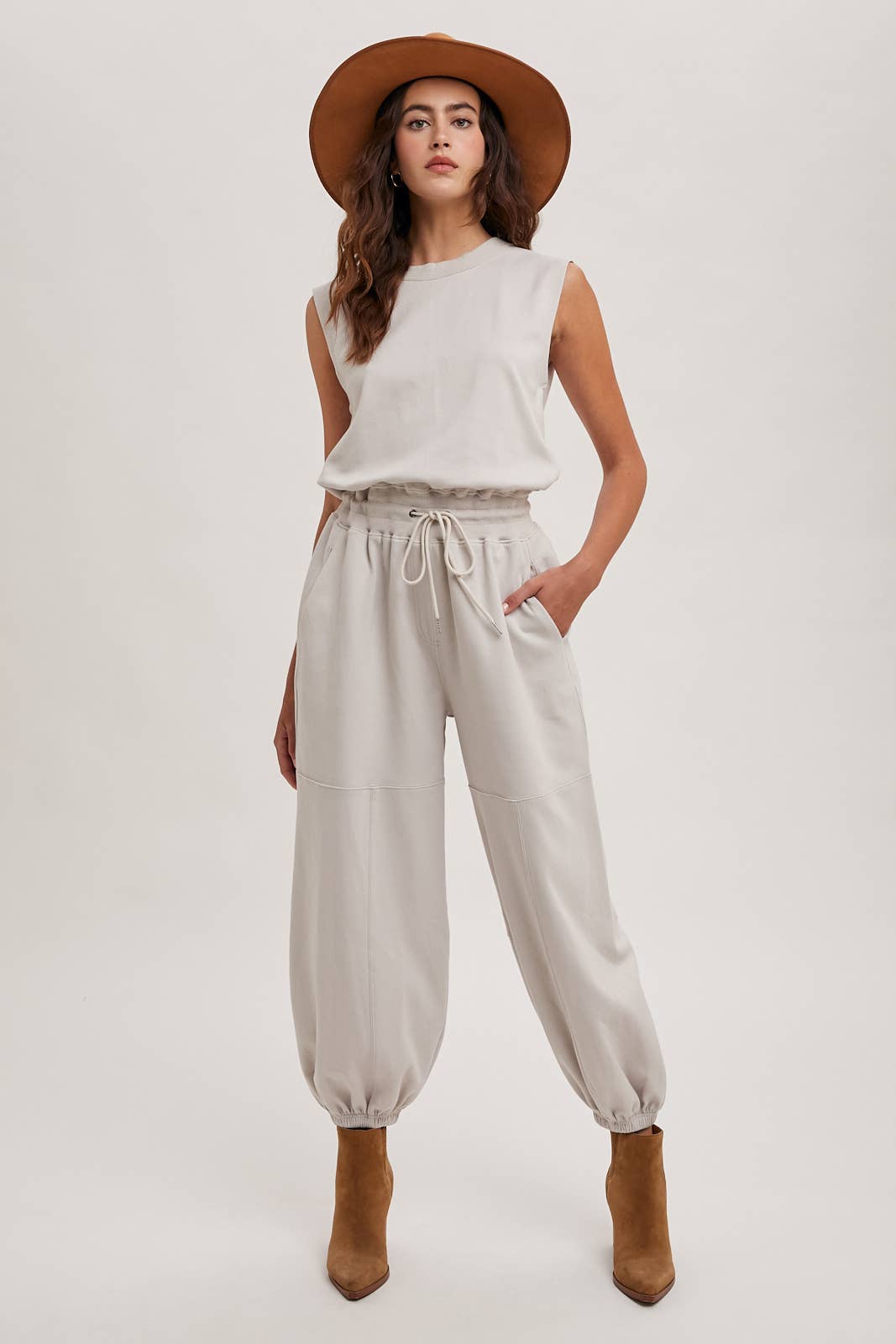 DRAWSTRING WAIST SLEEVELESS KNIT ACIVE JUMPSUIT: ECRU