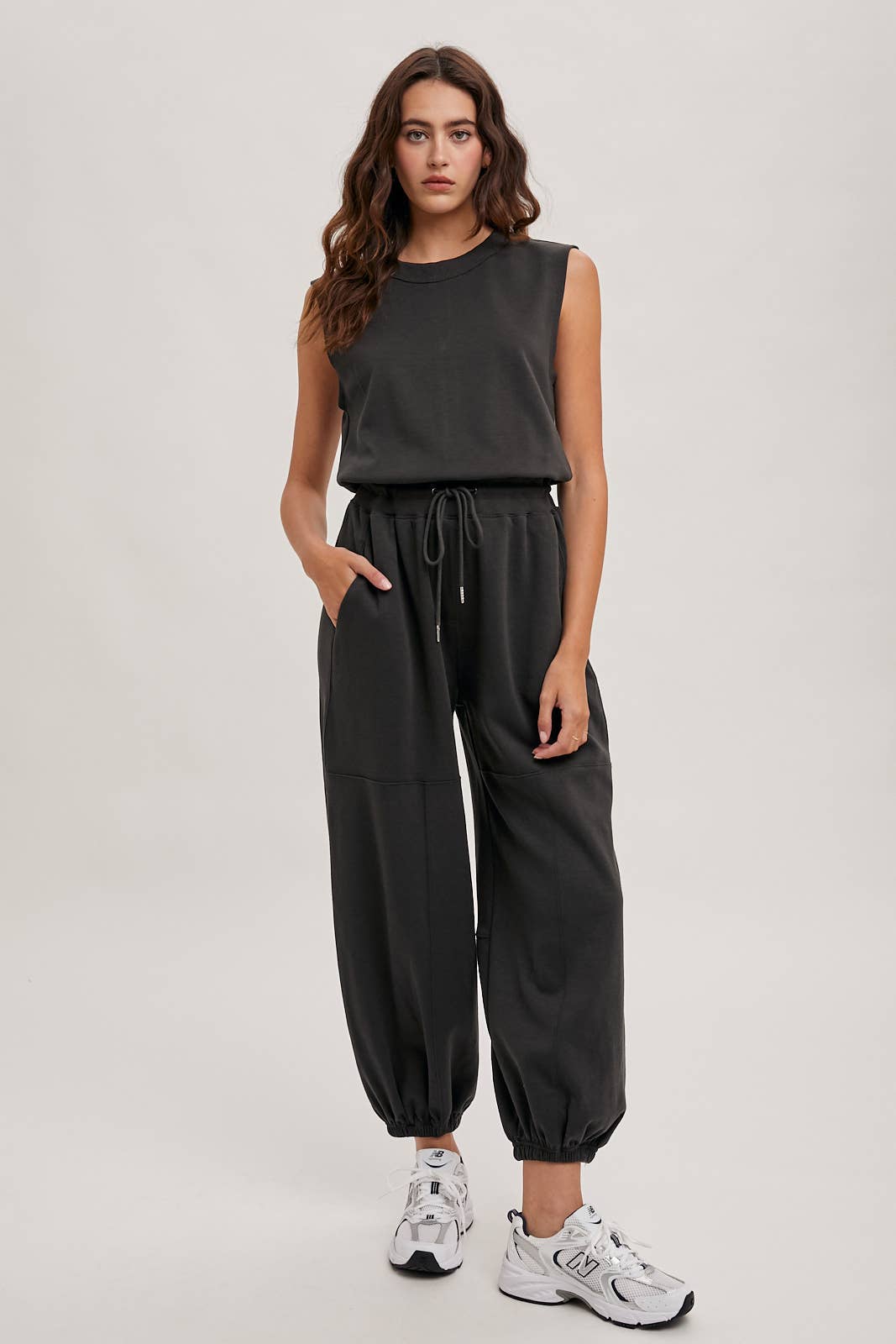 DRAWSTRING WAIST SLEEVELESS KNIT ACIVE JUMPSUIT: ECRU