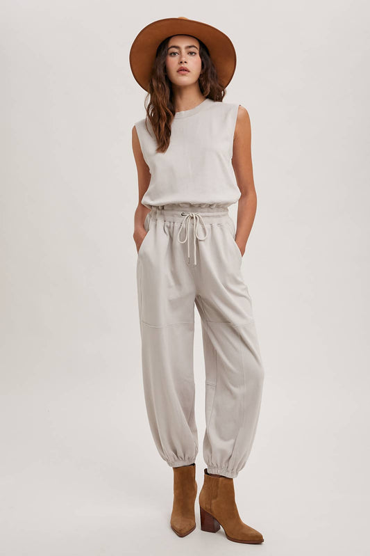 DRAWSTRING WAIST SLEEVELESS KNIT ACIVE JUMPSUIT: ECRU