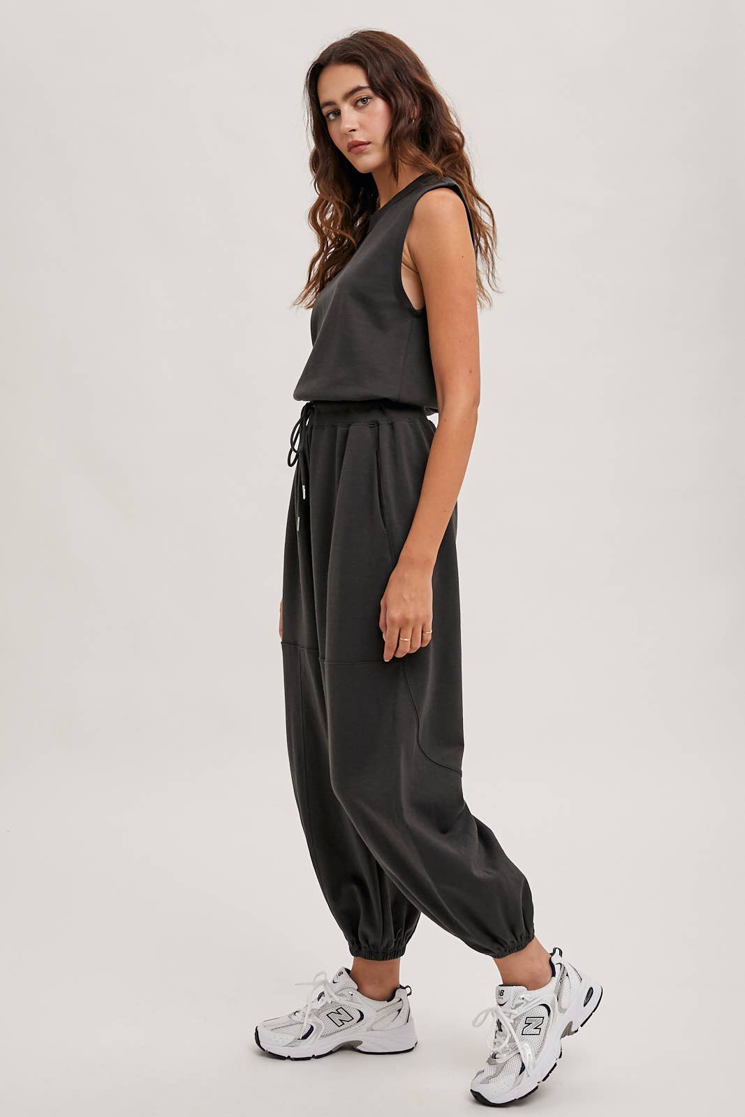 DRAWSTRING WAIST SLEEVELESS KNIT ACIVE JUMPSUIT: ECRU