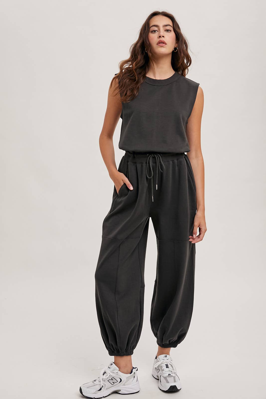 DRAWSTRING WAIST SLEEVELESS KNIT ACIVE JUMPSUIT: ECRU