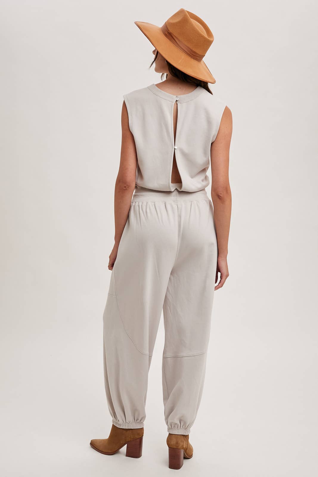 DRAWSTRING WAIST SLEEVELESS KNIT ACIVE JUMPSUIT: ECRU