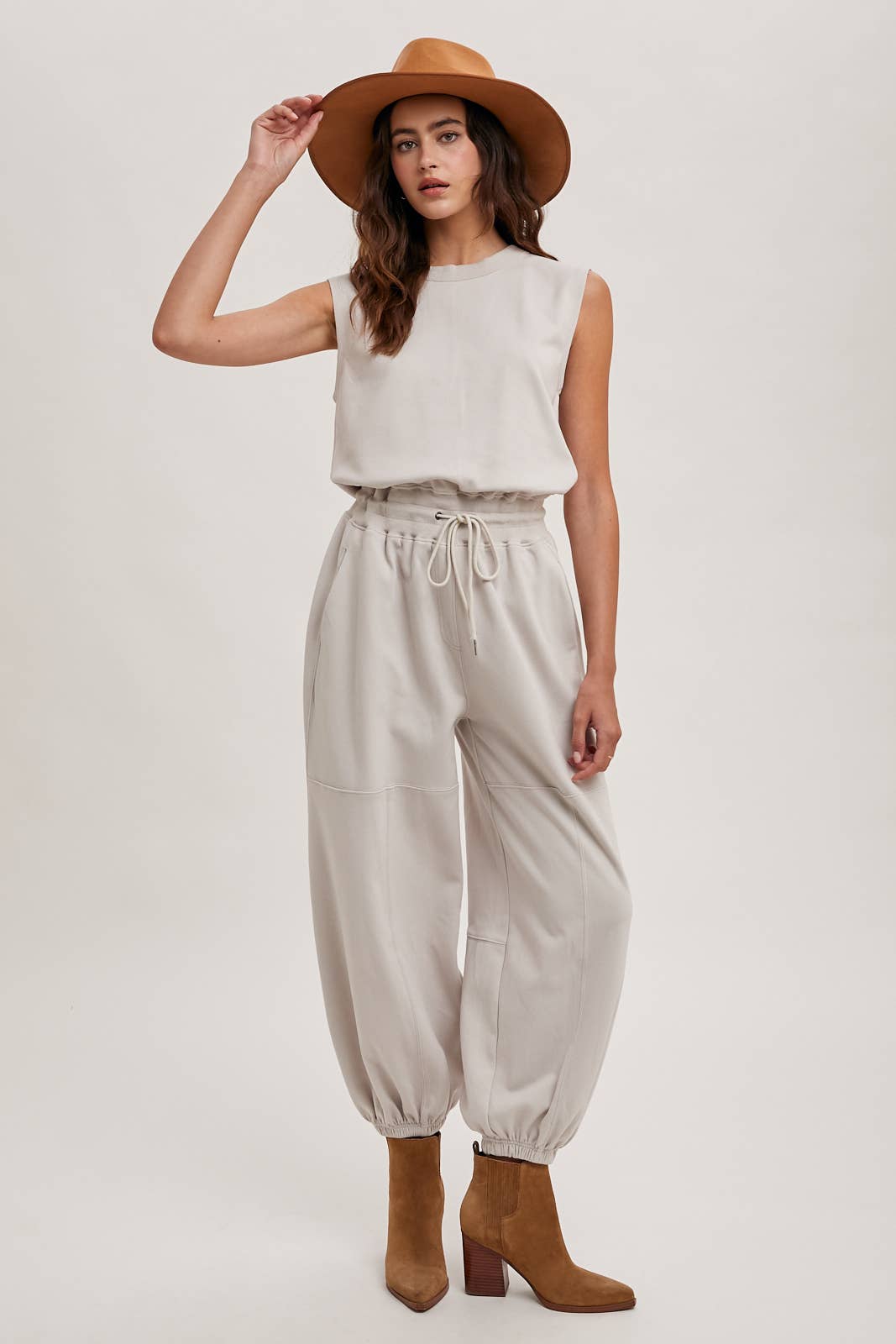 DRAWSTRING WAIST SLEEVELESS KNIT ACIVE JUMPSUIT: ECRU